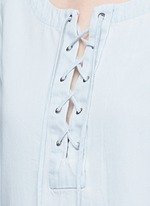 Detail View -Click To Enlarge Washed denim lace-up top