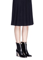 Figure View -Click To Enlarge Faux pearl scalloped cuff leather boots