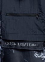 Detail View -Click To Enlarge 'Nike International Windrunner' foldable aerial print jacket