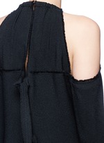Detail View -Click To Enlarge Torque neck cold shoulder crepe top