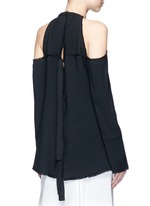 Back View -Click To Enlarge Torque neck cold shoulder crepe top
