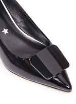 Detail View -Click To Enlarge Enamel plaque patent leather pumps