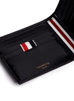 Detail View -Click To Enlarge Zen garden embossed leather bifold wallet