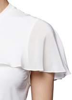 Detail View -Click To Enlarge Ruffle overlay cutout T-shirt