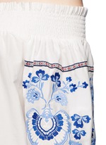 Detail View -Click To Enlarge Floral embroidery smocked off-shoulder top