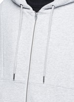 Detail View -Click To Enlarge Dip hem hooded jersey parka