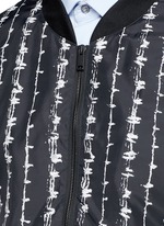 Detail View -Click To Enlarge Barb wire print bomber jacket