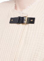 Detail View -Click To Enlarge Quilted buckled long coat
