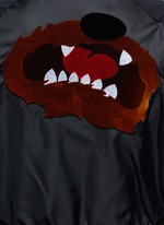 Detail View -Click To Enlarge Flocked animal print panelled bomber jacket
