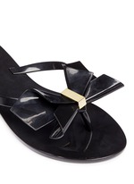 Detail View -Click To Enlarge 'Harmonic Bow II' butterfly front PVC flip flops