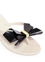 Detail View -Click To Enlarge 'Harmonic Bow II' butterfly front PVC flip flops