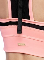 Detail View -Click To Enlarge 'Zip it up' mesh panel sports bra