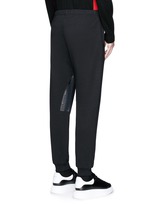 Back View -Click To Enlarge Perforated leather patch jogging pants