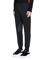 Front View -Click To Enlarge Perforated leather patch jogging pants