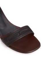Detail View -Click To Enlarge Stud tribal relief leather sandals