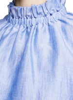 Detail View -Click To Enlarge Ruffle neck layered chambray sleeveless top
