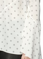 Detail View -Click To Enlarge Bell cuff star print silk top