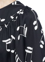 Detail View -Click To Enlarge Musical note print midi dress