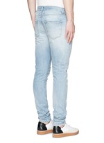 Back View -Click To Enlarge Repaired knee patch distressed skinny jeans