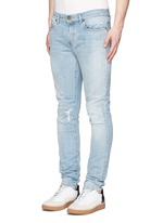 Front View -Click To Enlarge Repaired knee patch distressed skinny jeans
