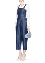 Detail View -Click To Enlarge 'Ava' extra small perforated leather crossbody bag