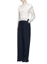 Figure View -Click To Enlarge Fringed shoulder metallic tweed knit sweater