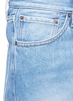 Detail View -Click To Enlarge Dipped hem whiskered jeans