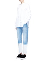 Figure View -Click To Enlarge Dipped hem whiskered jeans