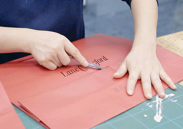 Team work: The making of our upcycled CNY displays - How our vibrant festive installations came about with the help of local craftswomen and a stack of old shopping bags