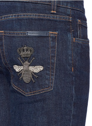 Detail View - Click To Enlarge - - - Crown bee embroidered slim fit raw jeans