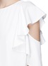 Detail View - Click To Enlarge - C/MEO COLLECTIVE - 'White noise' ruffle sleeve cutout crepe top