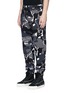 Front View - Click To Enlarge - HACULLA - Camouflage print scribble embroidered sweatpants
