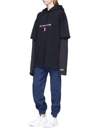 Front View - Click To Enlarge - VETEMENTS - Sleeve underlay logo embroidered oversized hoodie