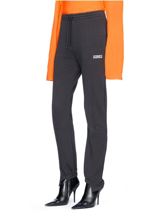 Front View - Click To Enlarge - VETEMENTS - Logo embroidered staggered cuff jogging pants