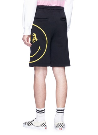 Back View - Click To Enlarge - PALM ANGELS - X Smiley® print sweat shorts