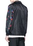 Back View - Click To Enlarge - YOHJI YAMAMOTO - x New Era rose print logo embroidered coach jacket