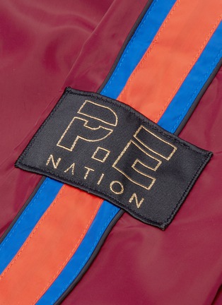  - P.E NATION - 'The Tactical' track stripe hooded jacket