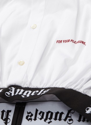  - PALM ANGELS - Slogan embroidered logo waistband cropped shirt