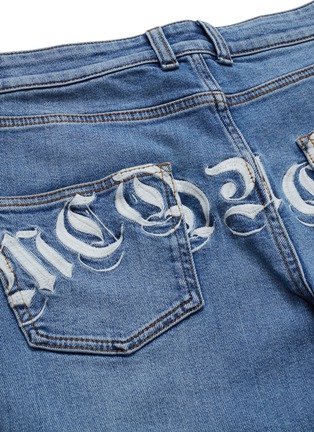  - ALEXANDER MCQUEEN - Logo embroidered jeans