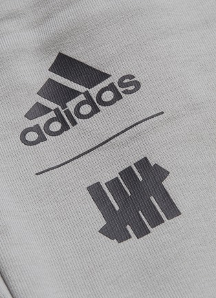  - ADIDAS X UNDEFEATED - Logo print sweatpants