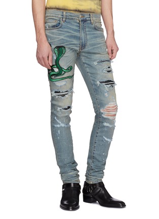 Front View - Click To Enlarge - AMIRI - Snake appliqué paint splatter ripped skinny jeans
