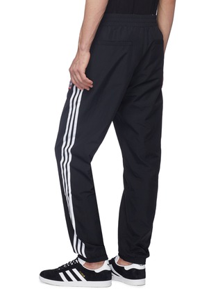 Back View - Click To Enlarge - ADIDAS X HAVE A GOOD TIME - Reversible 3-Stripes outseam logo embroidered track pants