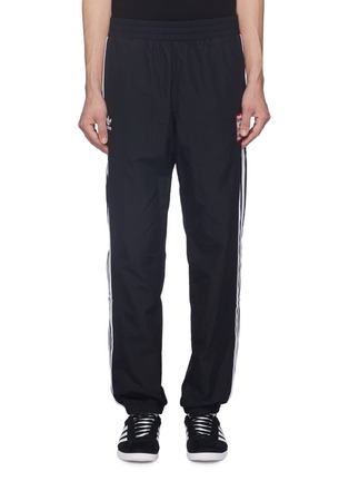 Main View - Click To Enlarge - ADIDAS X HAVE A GOOD TIME - Reversible 3-Stripes outseam logo embroidered track pants