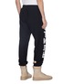Back View - Click To Enlarge - HERON PRESTON - Cyrillic letter print outseam sweatpants