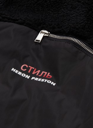  - HERON PRESTON - Cyrillic slogan print faux shearling panel jacket