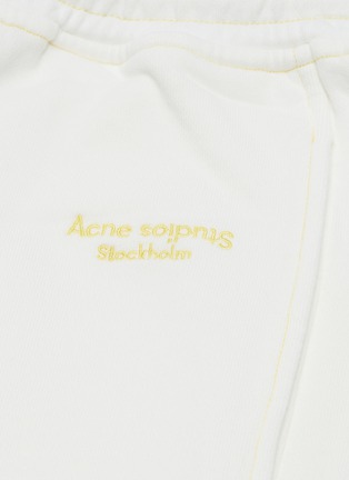  - ACNE STUDIOS - Logo embroidered acid washed jogging pants