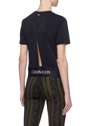 Back View - Click To Enlarge - CALVIN KLEIN PERFORMANCE - Slit back logo hem cropped performance T-shirt