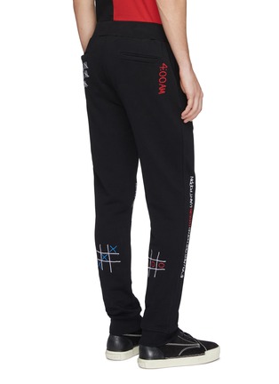 Back View - Click To Enlarge - HACULLA - Mix slogan graphic embroidered jogging pants