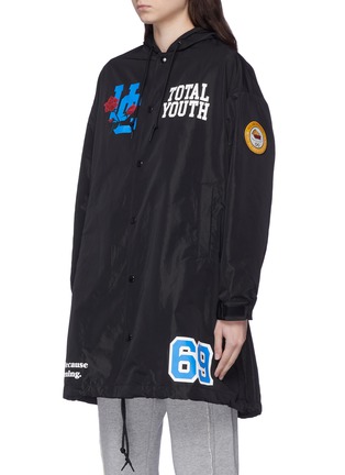 Front View - Click To Enlarge - UNDERCOVER - 'Total Youth' slogan rose print hooded raincoat