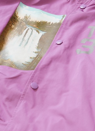  - UNDERCOVER - 'Former Juvenile' slogan graphic print hooded raincoat